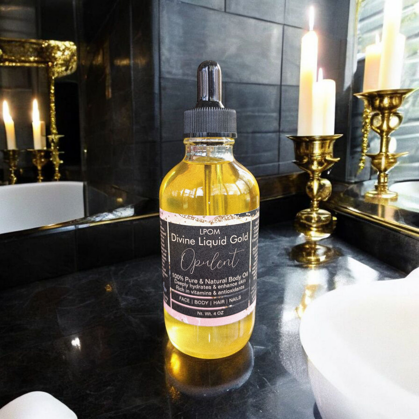 4 oz dropper bottle glass the Black label that reads Divine Liquid Gold scents name Opulent sitting in a bathroom sleek black marble with some candles tilliards and gold accents in a black bathroom setting