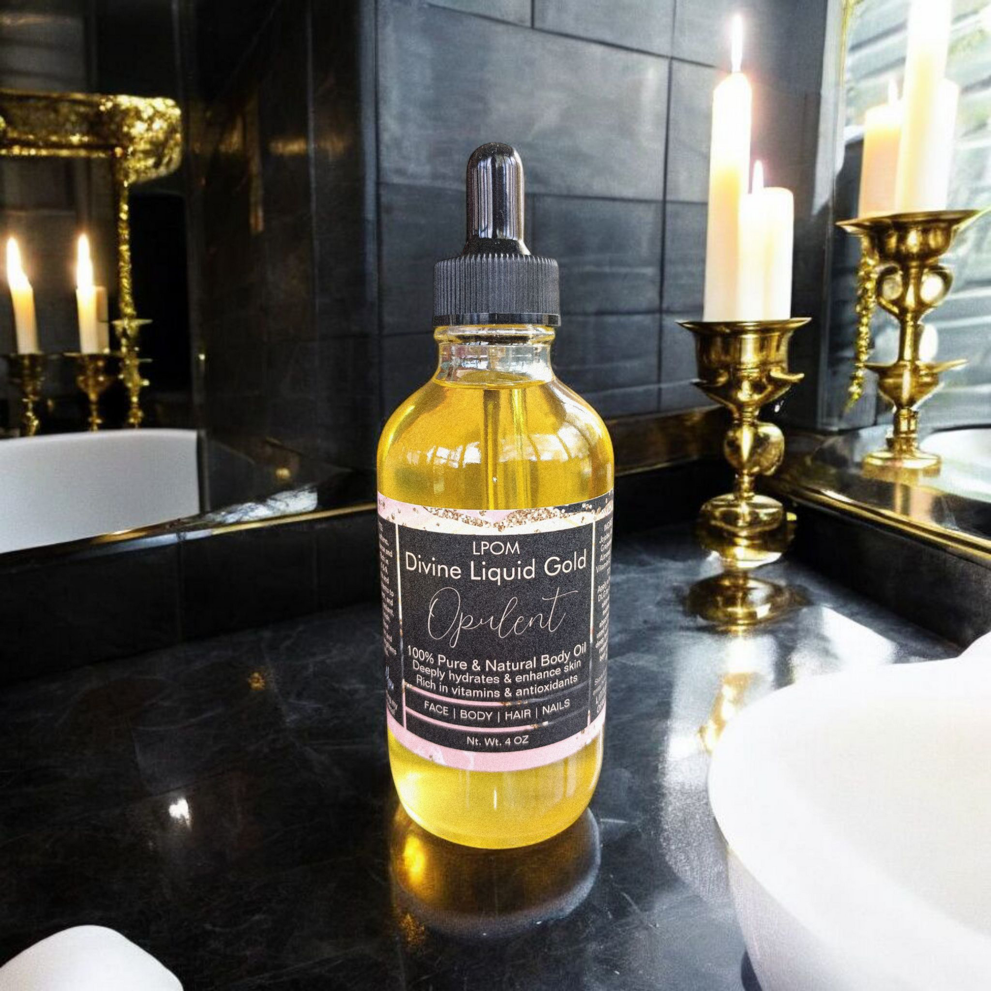 4 oz dropper bottle glass the Black label that reads Divine Liquid Gold scents name Opulent sitting in a bathroom sleek black marble with some candles tilliards and gold accents in a black bathroom setting