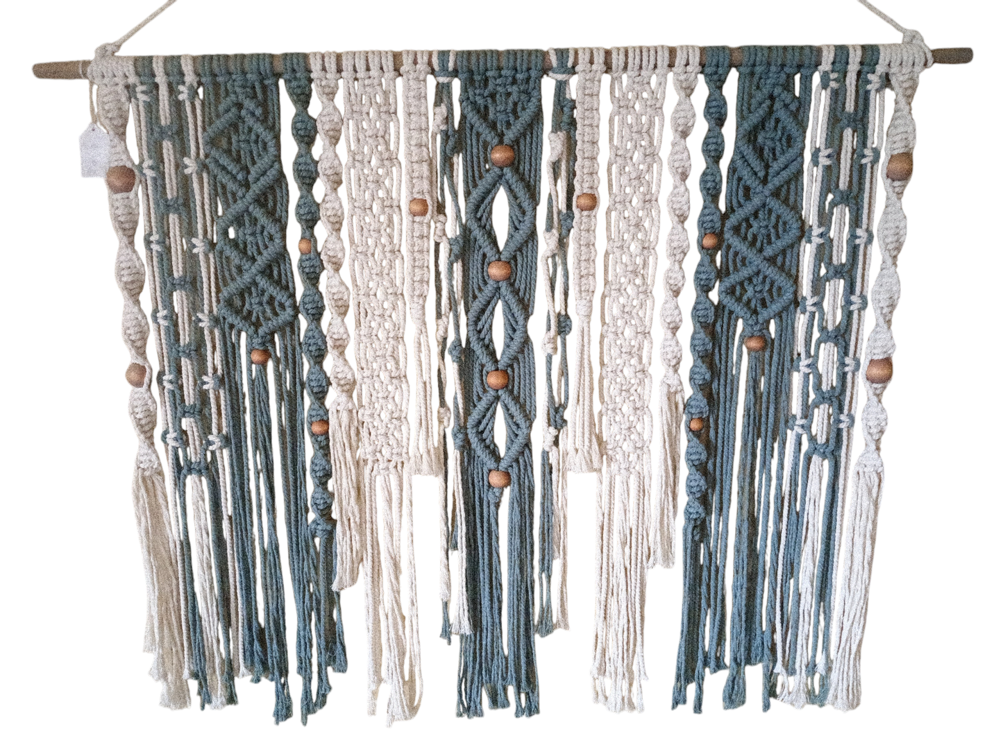 Handcrafted Bohemian wall hanging with intricate macramé patterns, 36 inches in length and 28 inches in height, designed to add warmth, texture, and a free-spirited touch to your space. Dark tealish Green and white with beads zoomed in closer uplook