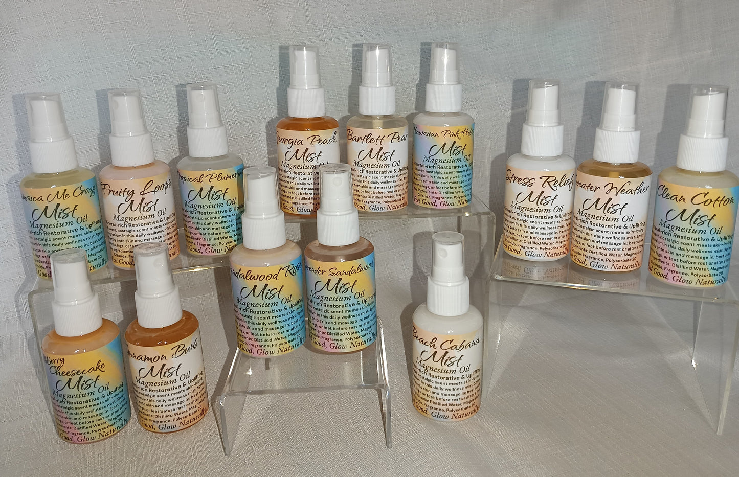 2oz clear spray bottle labeled magnesium spray, placed on a neutral background