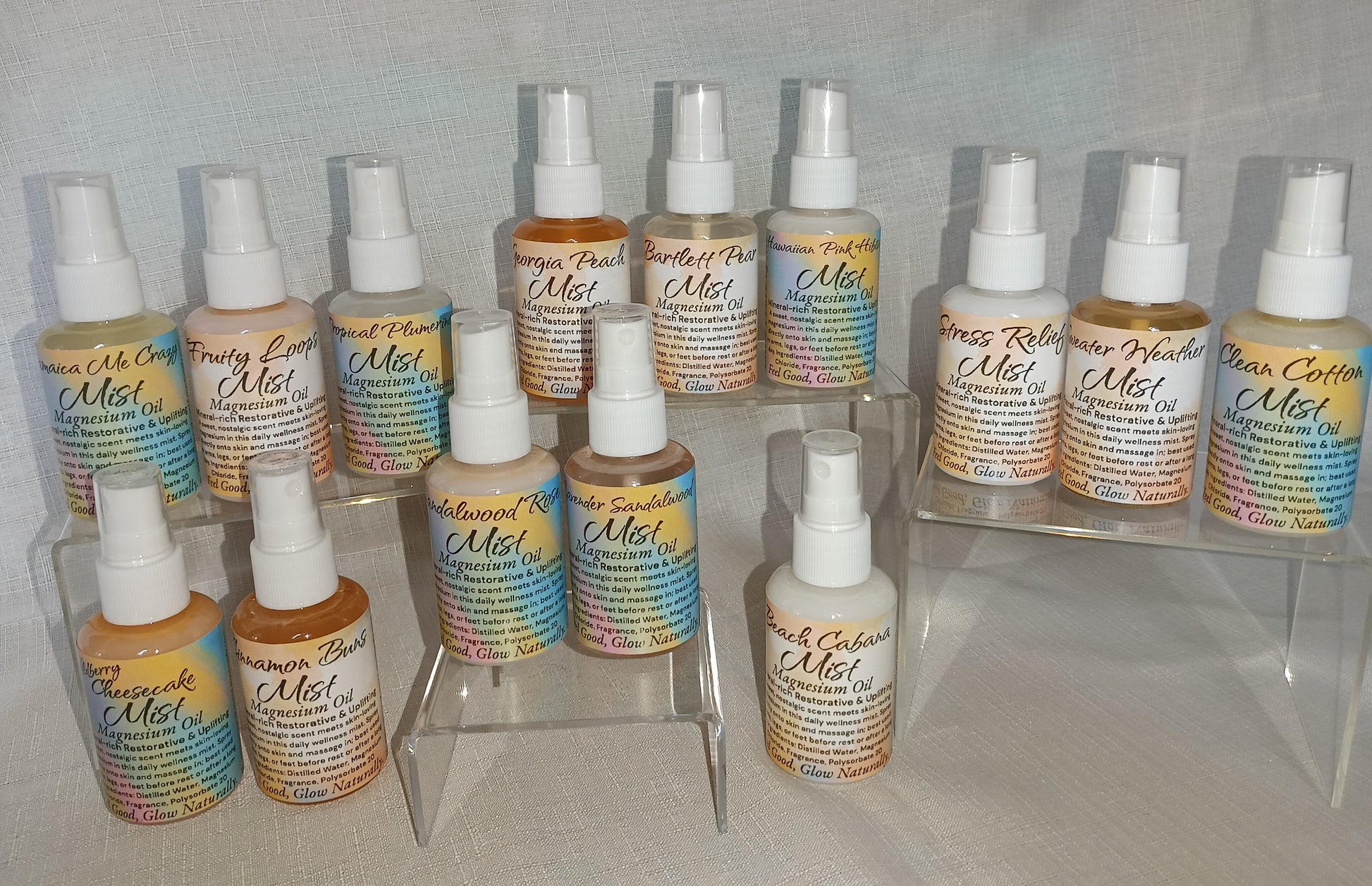 2oz clear spray bottle labeled magnesium spray, placed on a neutral background