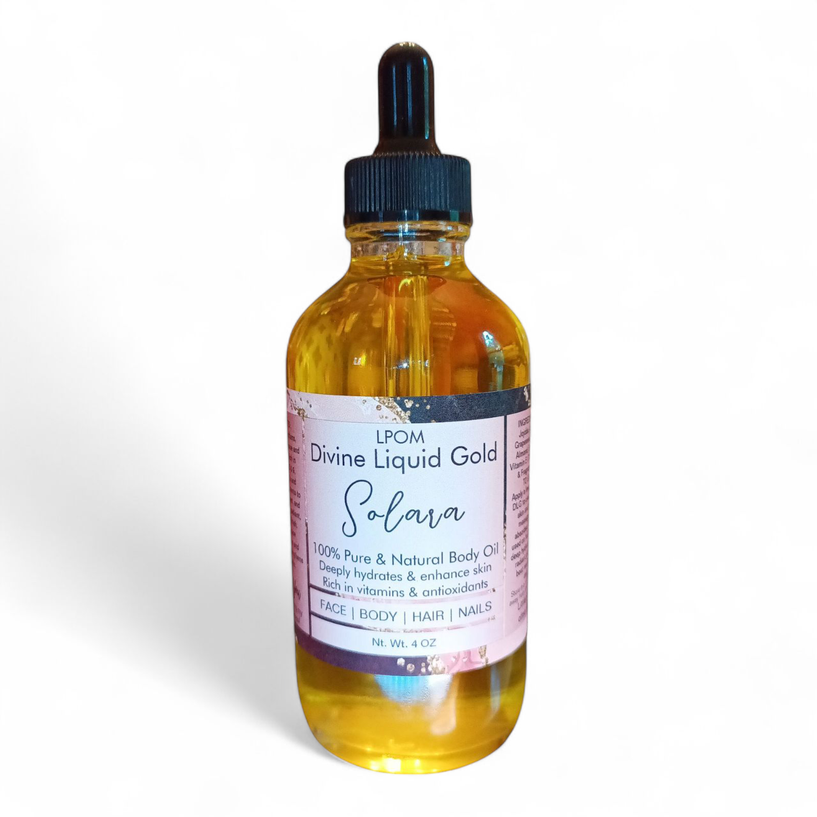 Glass Boston 4 oz clear dropper bottle with the label that says lpmo Divine Liquid Gold Solara on a white background with a light shadow