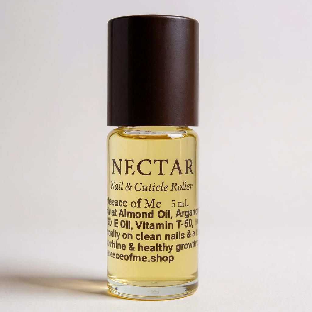 A little class roller bottle with a black cap on a white background with a medium shadow off to the side little bottle has a label that reads nectar