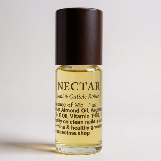 A little class roller bottle with a black cap on a white background with a medium shadow off to the side little bottle has a label that reads nectar